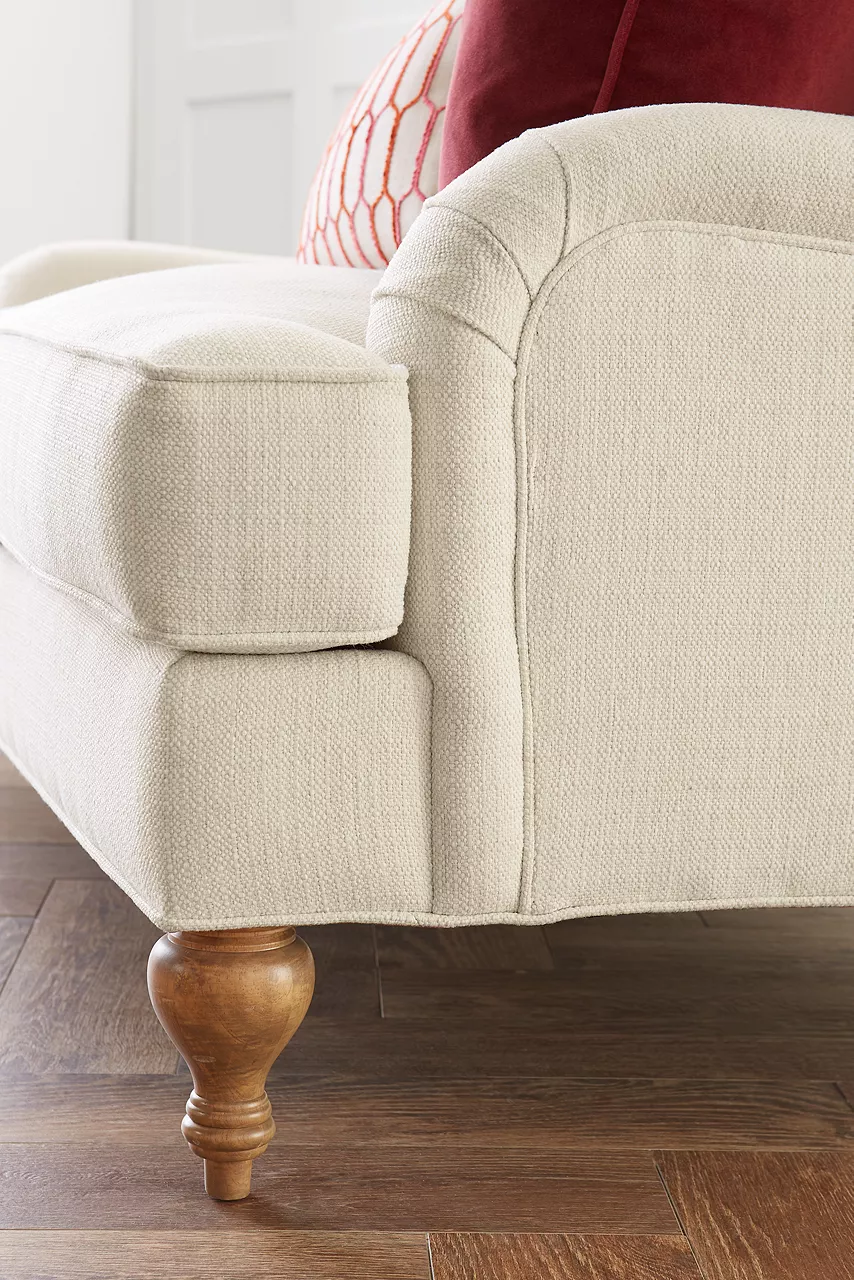 Detail of custom Erin sofa with rolled and and turned leg